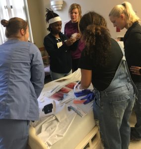 Nurse residents working through the escape room at UPMC Mercy Hospital