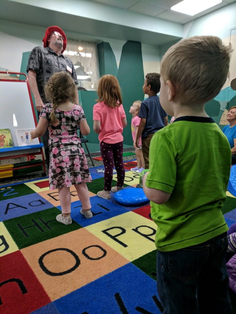 Children standing together as part of a group game