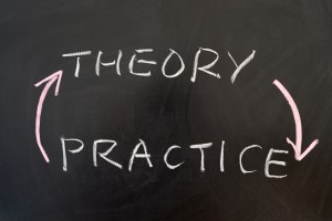 Theory and practice words written on the chalkboard