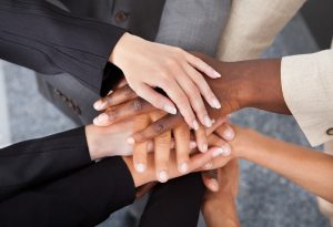 Multiracial Businesspeople Stacking Hands