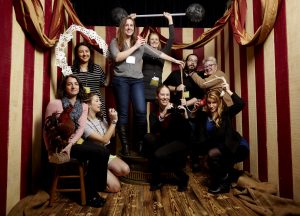Group of librarians posing in a circus themed photo booth.