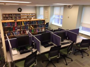 library computers and shelves of books