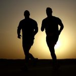 silhouette of runners