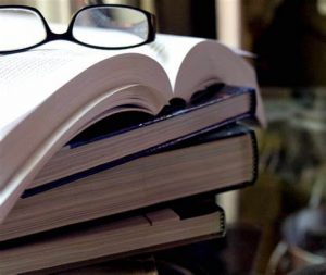 Books with reading glasses