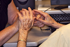 the hands of a blind/deaf woman learning to use the Web