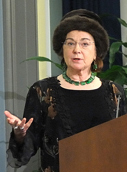 Elizabeth Fee talking in front of a podium