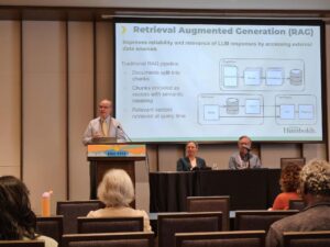 A man presenting at a podium.