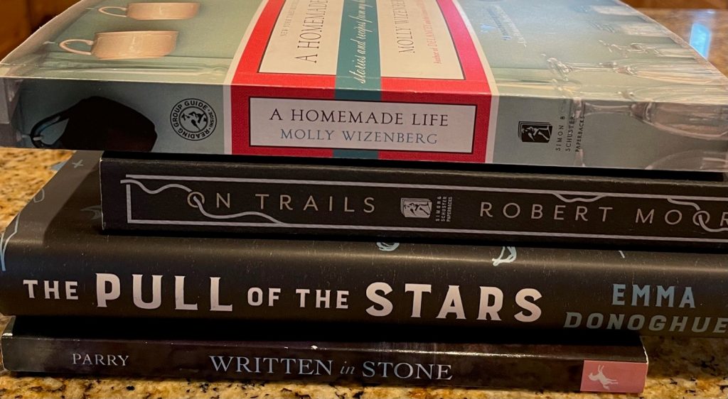 This book spine poem reads, "A Homemade Life, On Trails, The Pull of the Stars, Written in Stone."