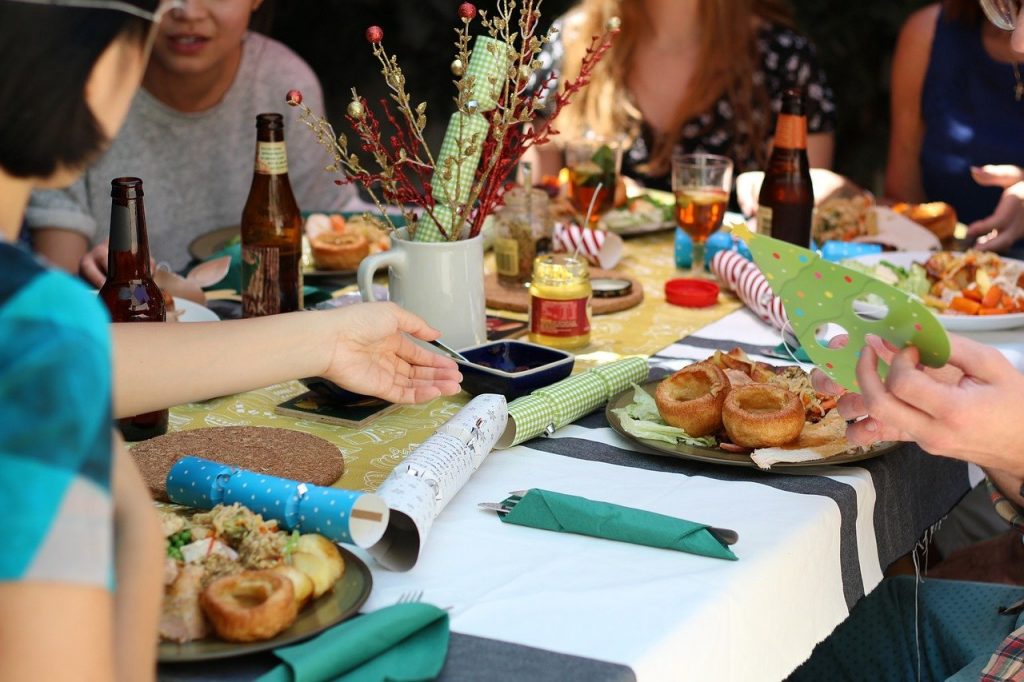 friends gathered around a holiday table