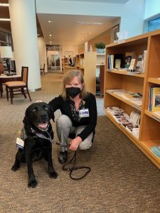 Basia and canine visitor the library