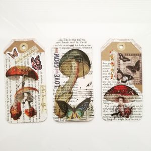 Papercraft. Three paper tags decorated with collage.