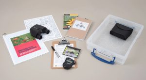 Observing pollinators kit with binoculars, field guide, case, clipboard and stop watch