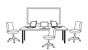 Chairs, table, and laptops set up in front of a large screen.